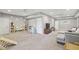 Open basement living room area with carpet, a sectional couch, and play area at 410 Dalrymple Ne Rd, Atlanta, GA 30328