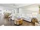 Bright living room featuring a large white sectional, hardwood floors, and modern decor at 410 Dalrymple Ne Rd, Atlanta, GA 30328