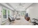 Spacious living room with a cozy sectional couch, bright windows, and plush carpeting at 410 Dalrymple Ne Rd, Atlanta, GA 30328