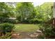 Large backyard with mature trees, shrubs and a well-maintained lawn, perfect for outdoor activities and entertaining at 492 Clifton Ne Rd, Atlanta, GA 30307