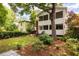 Well-maintained backyard with a two-story screened porch, mature trees, and inviting outdoor space for entertaining at 492 Clifton Ne Rd, Atlanta, GA 30307