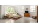Spacious basement living area features an oversized couch and a rustic wooden cabinet at 492 Clifton Ne Rd, Atlanta, GA 30307