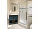 Charming bathroom featuring a shower with glass doors and a vanity with a blue cabinet at 492 Clifton Ne Rd, Atlanta, GA 30307