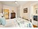 Cozy bedroom with a bed, dresser, and an ensuite bathroom view showcasing its blue vanity at 492 Clifton Ne Rd, Atlanta, GA 30307