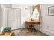 Bedroom featuring a vintage wooden desk, window with lots of natural light, and double door closet at 492 Clifton Ne Rd, Atlanta, GA 30307
