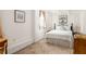 Cozy bedroom with crisp white linens, bedside lamps, and soothing artwork, offering a relaxing retreat at 492 Clifton Ne Rd, Atlanta, GA 30307
