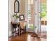 Charming entryway showcasing hardwood floors and antique drop-leaf table at 492 Clifton Ne Rd, Atlanta, GA 30307