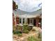 Attractive home with brick details, a cozy front porch, and carefully arranged landscaping at 492 Clifton Ne Rd, Atlanta, GA 30307
