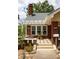 Attractive home with brick details, a cozy front porch, and carefully arranged landscaping at 492 Clifton Ne Rd, Atlanta, GA 30307