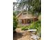 Attractive home with brick details, a cozy front porch, and beautiful natural landscaping at 492 Clifton Ne Rd, Atlanta, GA 30307