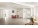 Bright living room featuring white brick walls, built-in shelves, and a cozy seating area with a door to the outside at 492 Clifton Ne Rd, Atlanta, GA 30307