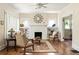 Bright living room with fireplace, hardwood floors, and comfortable seating arrangement at 492 Clifton Ne Rd, Atlanta, GA 30307