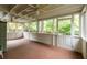 Enclosed sunroom with ceiling fans, wood floors, and an abundance of natural light, perfect for relaxing at 492 Clifton Ne Rd, Atlanta, GA 30307