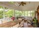 Inviting sunroom with lots of windows and a cozy seating area and large table at 492 Clifton Ne Rd, Atlanta, GA 30307
