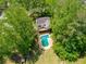 Aerial view of a home with a pool and a large, lush backyard at 51 Queen Anne Se Dr, Mableton, GA 30126