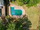 Aerial view of the pool and backyard with a lush green lawn at 51 Queen Anne Se Dr, Mableton, GA 30126