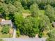 Aerial view of a home with mature trees and an in-ground swimming pool at 51 Queen Anne Se Dr, Mableton, GA 30126