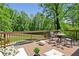 Inviting back deck overlooking a pool and backyard oasis, perfect for outdoor living at 51 Queen Anne Se Dr, Mableton, GA 30126