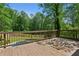 Wooden back deck with beautiful, lush backyard at 51 Queen Anne Se Dr, Mableton, GA 30126