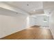 Finished basement with wood-look floors and a door to the outside at 51 Queen Anne Se Dr, Mableton, GA 30126