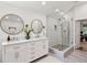 Sleek bathroom features double sinks, marble-look shower, and stylish fixtures at 51 Queen Anne Se Dr, Mableton, GA 30126
