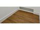 Close-up view of beautiful hardwood flooring and clean white baseboards at 51 Queen Anne Se Dr, Mableton, GA 30126