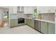 Charming kitchen with two-tone cabinets, stainless steel appliances, and stylish backsplash at 51 Queen Anne Se Dr, Mableton, GA 30126