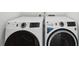Modern laundry room with side-by-side washer and dryer at 51 Queen Anne Se Dr, Mableton, GA 30126