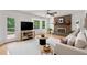 Comfortable living room with brick fireplace, large windows, and stylish furnishings at 51 Queen Anne Se Dr, Mableton, GA 30126