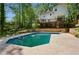 A backyard oasis with an in-ground pool, a spacious deck, and a charming two-story home at 51 Queen Anne Se Dr, Mableton, GA 30126