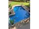 Inviting in-ground pool with a concrete deck and mature landscaping, perfect for relaxation at 51 Queen Anne Se Dr, Mableton, GA 30126