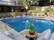 Backyard with a beautiful in-ground pool, lounge furniture, and manicured landscaping at 51 Queen Anne Se Dr, Mableton, GA 30126