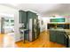 Spacious kitchen featuring stainless steel appliances, an island with seating, and views into the dining area at 1652 Oak Grove Rd, Decatur, GA 30033