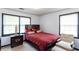 A cozy bedroom features a Queen bed, an end table with a lamp, and a decorative chair at 203 Leigh Dr, Ellenwood, GA 30294