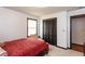 Bedroom with neutral walls, carpet, dark trim, natural light, and a Queen-sized bed at 203 Leigh Dr, Ellenwood, GA 30294