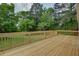 A spacious wooden deck with a beautiful backyard view at 203 Leigh Dr, Ellenwood, GA 30294