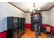 Traditional dining room featuring a wood floor, a mirrored armoire, and a hutch at 203 Leigh Dr, Ellenwood, GA 30294