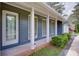 Close-up of front entrance, featuring a decorative glass door and neat landscaping at 203 Leigh Dr, Ellenwood, GA 30294