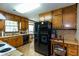 Traditional kitchen with wooden cabinets and appliances at 203 Leigh Dr, Ellenwood, GA 30294