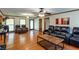 Open-concept living room with hardwood floors, comfortable seating, and plenty of space at 203 Leigh Dr, Ellenwood, GA 30294