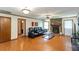 Inviting living room featuring a stone fireplace and cozy seating area, perfect for relaxation at 203 Leigh Dr, Ellenwood, GA 30294