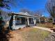 Charming gray home with a inviting front porch and manicured landscaping at 455 Lynch Nw Ave, Atlanta, GA 30318
