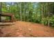 The sloped backyard features a wooden deck and access stairs at 4788 Rock Island Nw Ln, Acworth, GA 30102