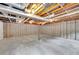 Unfinished basement with exposed beams, concrete floor, and wall insulation at 4788 Rock Island Nw Ln, Acworth, GA 30102