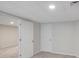 Finished basement features neutral walls, carpet flooring, and access to unfinished area at 4788 Rock Island Nw Ln, Acworth, GA 30102