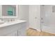 Bathroom features a white vanity and a shower over tub with white subway tiles at 4788 Rock Island Nw Ln, Acworth, GA 30102