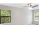 Bright bedroom featuring large windows overlooking lush greenery at 4788 Rock Island Nw Ln, Acworth, GA 30102