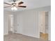 Bedroom featuring two doorways and a modern ceiling fan at 4788 Rock Island Nw Ln, Acworth, GA 30102