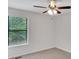 Neutral bedroom features a window and ceiling fan for added comfort at 4788 Rock Island Nw Ln, Acworth, GA 30102