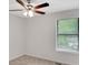 Cozy bedroom featuring a ceiling fan and bright natural light at 4788 Rock Island Nw Ln, Acworth, GA 30102
